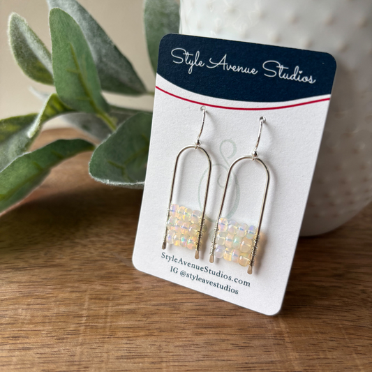 Ladder wrapped opal rondelles inside an upside down U wire frame by Style Avenue Studios